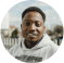 A thumbnail of a black man wearing a white color hoodie